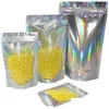 Bolsas de embalaje Venta al por mayor Bolsas a prueba de olores resellables Plástico Stand Up Bolsa con cremallera holográfica Láser Paquete de papel de aluminio Bolsa para alimentos DH4W3