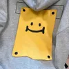 Mäns hoodies tröjor grå trendig etikett broderad smiley ansikte huvtröja för kvinnors vår och hösten amerikansk lat stil