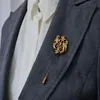 Broches de escudo de Dragón Dorado Unisex, ramillete de camisa para traje, Pin de solapa, broche con cadena, regalo de joyería para mujeres y hombres, 12 Uds. 1965