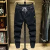 Jeans da uomo Primavera Harajuku Design Moda Coulisse Casual Denim Cintura Gamba affusolata Streetwear Pantaloni da lavoro Uomo