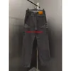 23SS Jeans da uomo di design italiano Jeans di taglia americana Casual Street Fashion Tasca calda da uomo calda da donna Coppia pantaloni da jogging da uomo