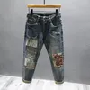 Erkekler Kişisel Kişiselleştirilmiş Moda Tasarımcısı Erkekler için 2023 İnce streç hip hop patchwork Erkek Retro Street Denim Pantolon