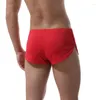 Pantaloncini da corsa da uomo sexy con spacco laterale in seta di ghiaccio, pantaloni sportivi da jogging traspiranti ad asciugatura rapida, fondo elastico per allenamento fitness