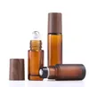 5 ml 10 ml 15 ml bouteilles à bille en verre ambré bouchon en plastique à grain de bois bouteille de parfum d'huile essentielle givrée avec bille roulante en acier inoxydable SN5293