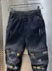 Jeans da uomo Street Jeans Hip Hop Uomo Pantaloni sportivi Harem con cuciture a griglia Novità nel marchio di design Stackes Pantaloni larghi da cowboy Abbigliamento moda J231011