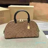 2023 Designer de luxe femmes sac à main poignée de bagage Designers sacs à bandoulière sac à bandoulière classique rétro coquille sac pochette décontractée