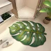 緑の植物のデザインを備えたバスルームの吸収性とスリップ耐性のための豪華なユニークな形の敷物231010