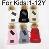 1-12歳の子供たちの温かい冬の帽子デザイナービーニーバケツサンタハットボブルニットニット子供用スカルキャップレターフィットハット5色