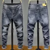 Jeans pour hommes Style explosif Mode jeunesse Mi-taille Tendance coréenne Pantalon en denim avec petits pieds