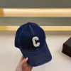 hip hop dark Blue worn-out washed denim baseball cap with sun shading and fashion Letter logo embroidery ball cap designer