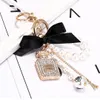 Designer Pearl Perfume Bottle Keychain Car Key Ring Women Bag Charm Perfume Accessories Cute Bow Key Chain Creative Keyrings Bag Ornaments