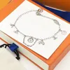 Nuovi accessori di lusso del regalo del braccialetto di cerimonia nuziale delle coppie dell'acciaio inossidabile dell'argento sterlina dei gioielli dello stilista di lusso all'ingrosso -007