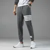 Pantaloni di vendita caldi per pantaloni casual da uomo autunnali comodi pantaloni sanitari versione coreana tendenza pantaloni sportivi vestibilità piccola per pantaloni da uomo