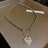 Ожерелья с подвесками, модное тонкое 14-каратное позолоченное ожерелье с замком в форме сердца 7 для женщин и девочек, Т-образная цепочка с пряжкой, ювелирные изделия, цирконий AAA 231011