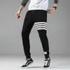 Pantaloni sportivi a quattro barre a gambe larghe primaverili pantaloni casual da uomo autunnali chiusi da corsa per fitness e moda