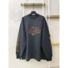 Skjorta toppar herr mode Balenciaga version Familjedesigner 23SS Autumn New Flame Graffiti Letter Par Casual Loose Long Sleeve T-shirt