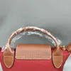 Atacado bolsa de couro fora 2024 e saco coração bolsa sacos vermelhos primavera verão borse folga 95% sac luxe femme mini bolinhos femininos