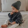 カーディガンベイビーセーター秋の冬のソリッドカラー幼児のための編み付けセータールーズラウンドネックキッズアウトウェア服231013