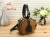 2023 Designer de luxe Boite Chapeau Sac rond Gâteau Sac à bandoulière en peau de vache Nano Sac à main Cluchs Sac pour appareil photo mobile pour femme Sac de maquillage Dhgate Sac à bandoulière Nouveau