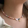 Collier ras du cou en perles colorées, accessoires Boho, pendentif avec lettre initiale en acier inoxydable, bijoux à la mode en forme de cœur et de coquillage