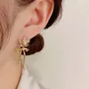 Boucles d'oreilles créoles en cuivre plaqué or 18 carats, Version coréenne en forme de nœud de fleur pour femmes, incrusté de zircone, Design Unique de haute qualité