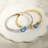 Bangle Jinhui Circle Hollow Stitching الفولاذ المقاوم للصدأ للنساء اللامعة الكريستال البيضاوي العين سحر العين سوار العين المجوهرات