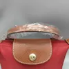 Atacado bolsa de couro fora 2024 e saco coração bolsa sacos vermelhos primavera verão borse folga 95% sac luxe femme mini bolinhos femininos