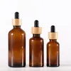 Amber Glass Droper Bottle With Bamboo Lids Essential Oils flaskor Provflaskor för parfym Kosmetiska vätskor 15 ml 20 ml 30 ml 50 ml 100 ml HBNNP