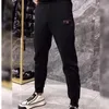 Heren trainingspakken ontwerper lente Europese zakelijke casual broek voor heren, zwarte trend, sportbroek met kleine pijpen, loszittende broek trend BRU7 D8SU