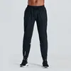 2023 Designer calças compridas homens esporte correndo alinhar yoga ao ar livre ginásio bolsos slim fit sweatpants pant jogger calças mens casual elástico uomj