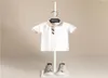 Camicie 039s New Summer Baby boy Camicie Blank Top Tees Manica corta T-shirt in cotone bianco nero per bambini Abbigliamento per ragazza2091523788