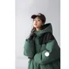 Autumn and winter women hooded thick loose down coat tooling style bread clothing version of loose not bloated fashionable warm and comfortable. CC