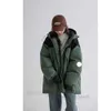 Autumn and winter women hooded thick loose down coat tooling style bread clothing version of loose not bloated fashionable warm and comfortable. CC