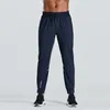 2023 Designer calças compridas homens esporte correndo alinhar yoga ao ar livre ginásio bolsos slim fit sweatpants pant jogger calças mens casual elástico uomj