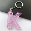 Nyckelringar 1 st rosa färg Keyring Engelska bokstav 26 ord Glitter harts a till z handväska charm för kvinna