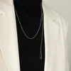 Collier long métallique avec pendentif en chaîne à la mode et pompon réglable pour femme