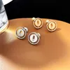 2023 Ny lyx S925 Sterling Silver smycken Lucky Move Stud Earring Round Coin Design Trendy Slide Moving CZ Cubic Zircon Stone E244B