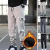 Pantaloni da uomo da uomo tinta unita multi tasche con coulisse fodera in peluche a prova di freddo autunno inverno addensare carico alla caviglia legato per lavorare