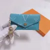 985 Llavero de diseño de lujo Moda para mujer Mini billetera de alta calidad de cuero genuino para hombre Monedero Color Carteras Titular 852