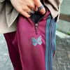 Męskie spodnie igły przybudź bawełniany motyl haft haftowy vintage paski do paska spusty oversize 1: 1 Czerwone dresowe kobiety kobiety