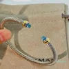 Bangle Cable Classic Collection Armband med Blue Topaz och Black Onyx 18K Yellow Gold2947
