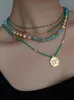 Halsketten mit Anhänger, afrikanische Jade, grün getäfelte Perle, Goldmünzen-Halskette, leichte Luxus-Nischen-Schlüsselbeinkette