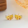 Pendientes de tuerca de alta calidad para mujer, elegante Zirconia, hoja de Ginkgo, forma de Color dorado, joyería de diamantes de imitación de lujo para fiesta