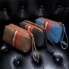 New handbag men's hand bag canvas leisure clutch bag Korean ladies will hand in hand with mobile phone coin purse.