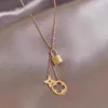 Collier trèfle à quatre feuilles, chaîne de trèfle à quatre feuilles, serrure à timbre, bijoux en acier titane de styliste pour femmes