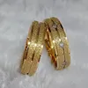 Pierścionki ślubne Wysokiej jakości zestawy pary dla mężczyzn i kobiet luksusowy zachodni Dubaj African African 24k Gold Gold Biżuteria ze stali nierdzewnej 231016