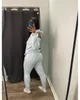 Designer de malha tracksuits dois conjuntos de peças mulheres outono inverno sweatsuits manga longa tricô com capuz camisola superior e calças outono outfits atacado roupas 10206