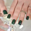 Unghie finte 24 pezzi Colore verde Glitter Unghie corte squovali Premere sulle punte delle unghie Manicure lucida Arte finta per l'uso quotidiano con linguette