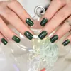 Unghie finte 24 pezzi Colore verde Glitter Unghie corte squovali Premere sulle punte delle unghie Manicure lucida Arte finta per l'uso quotidiano con linguette