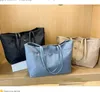 حقائب تسوق المصممين العلامات التجارية Women Triangle Label Label Proof Leisure Bag Bag كبيرة السعة النايلون Mommy Tote P2301017